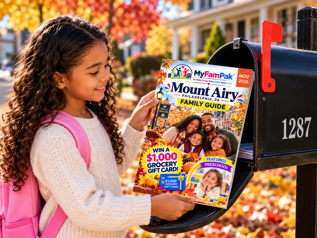 A girl taking the MyFamPak Family Guide out of her family mailbox