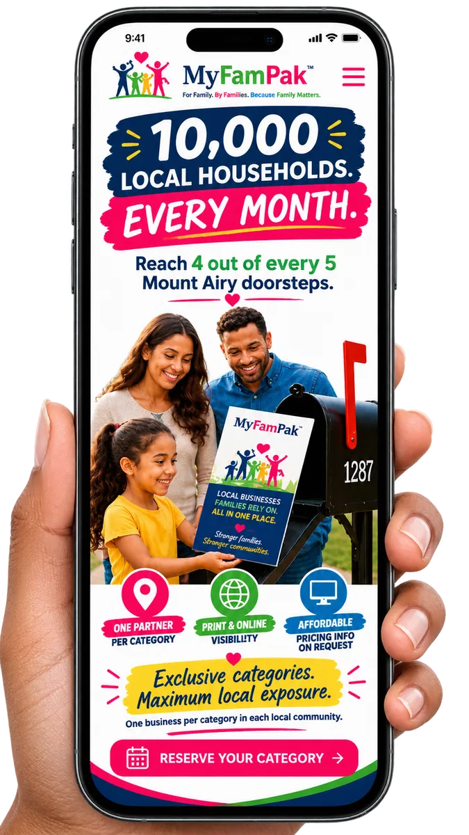 A hand holding a smartphone showing the MyFamPak landing page