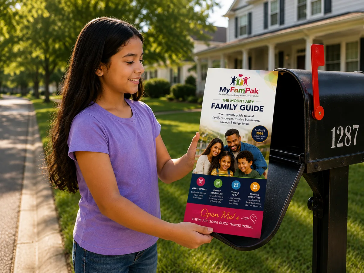A girl taking the MyFamPak Family Guide out of her family mailbox